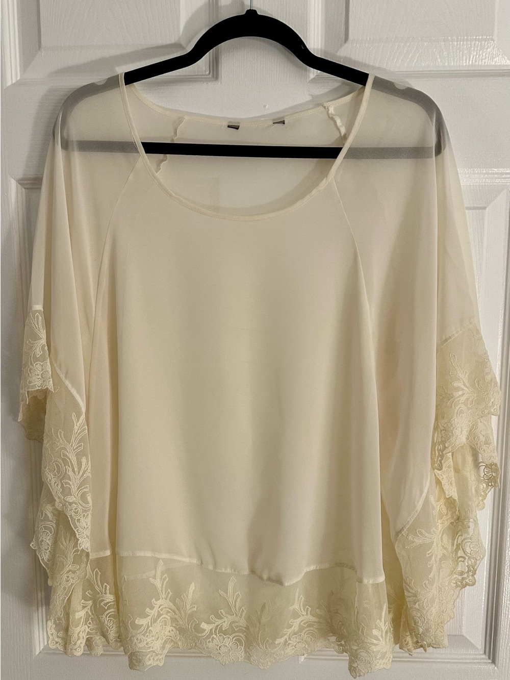 Express cream poncho with lace trim